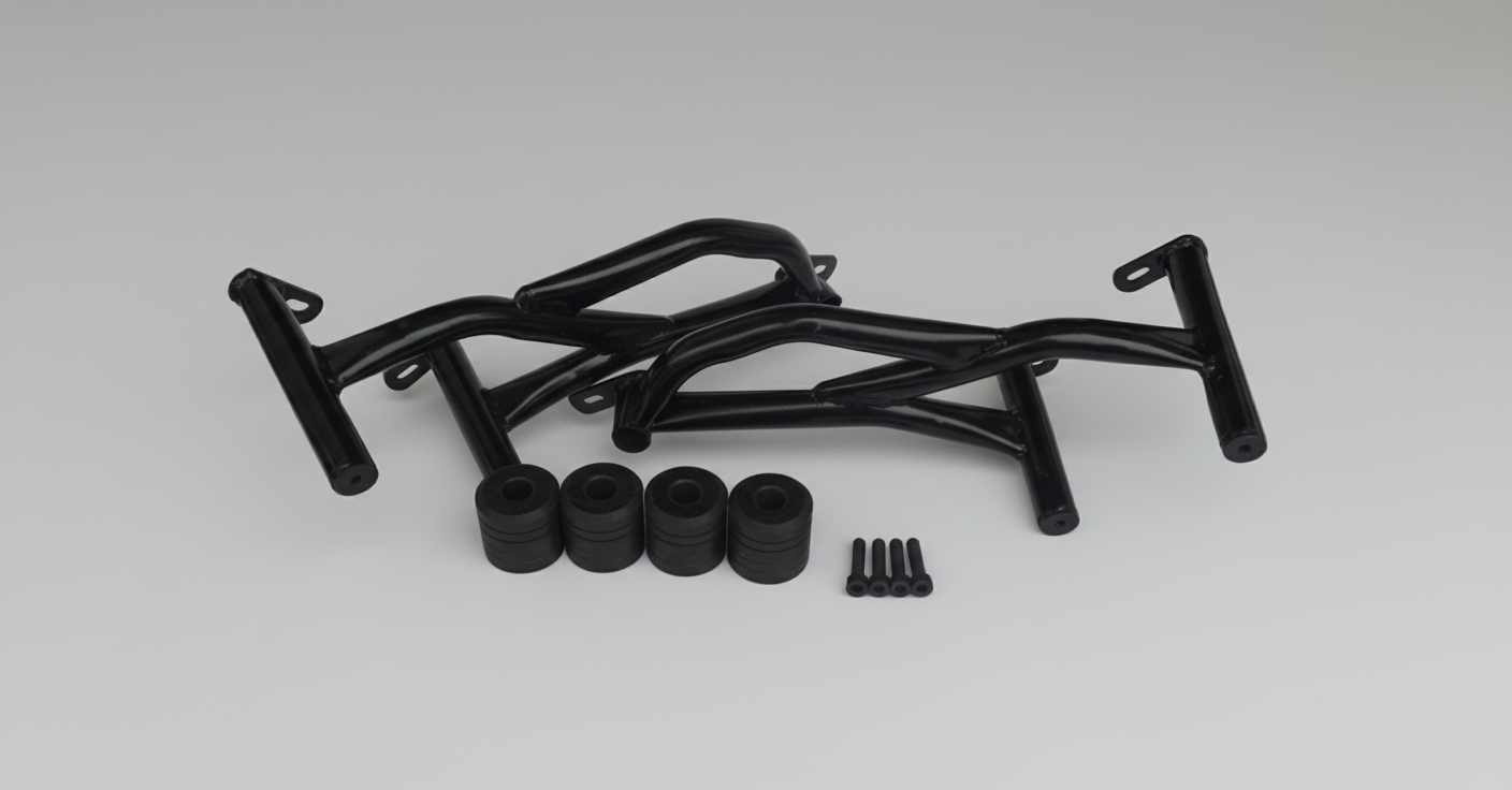 Black metal frame components on a white surface with cardboard boxes in the background