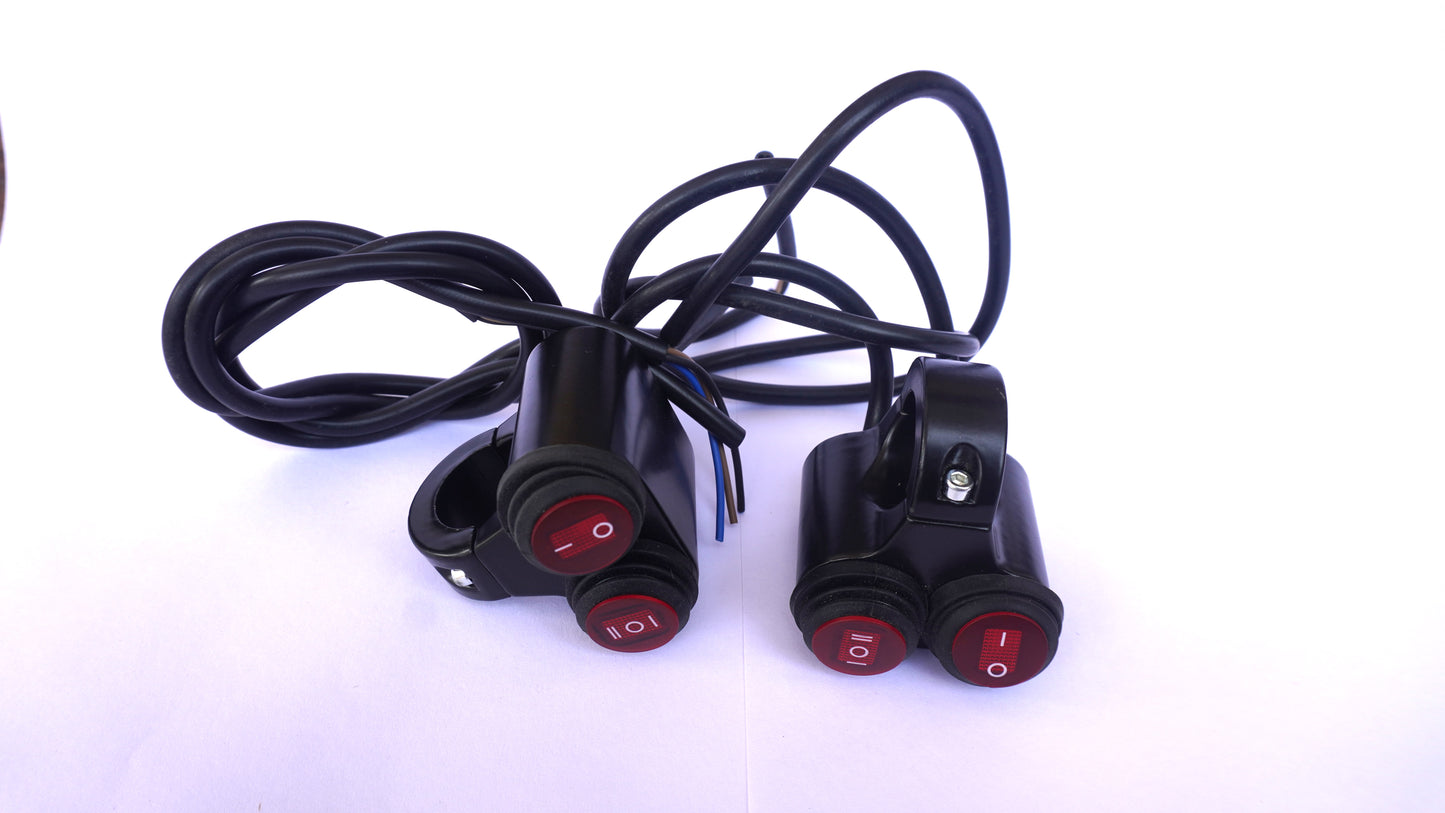 Three motorcycle turn signals with red lights and black cables on a white background